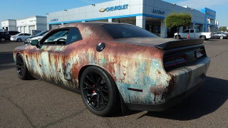 Illustration for article titled This Rust-Wrapped Dodge Challenger SRT Hellcat Is Making Me Have a True Existential Debate